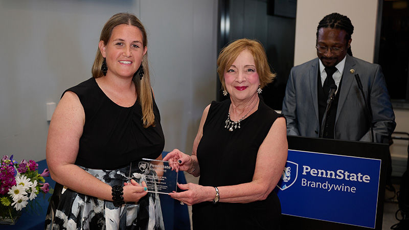 Bobbi Caprice accepting the 2022 Lion's Heart Young Alumni Award