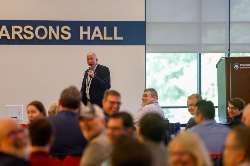 man speaking to audience