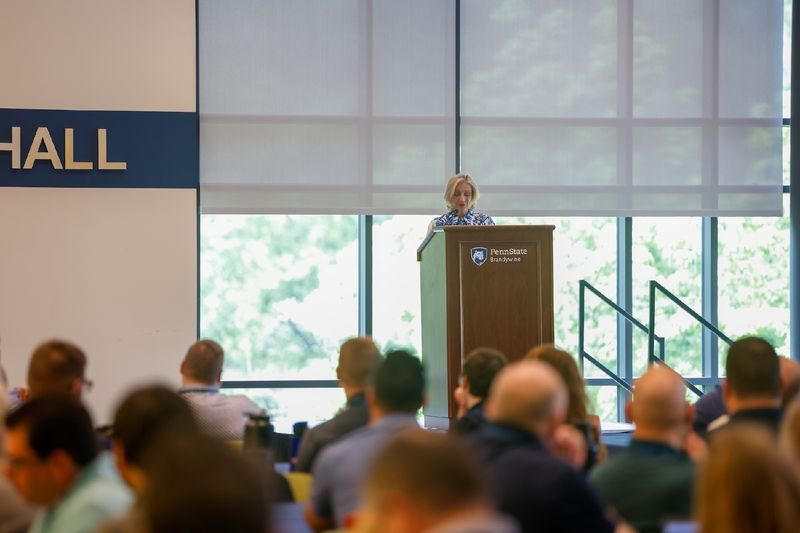 woman speaking at podium