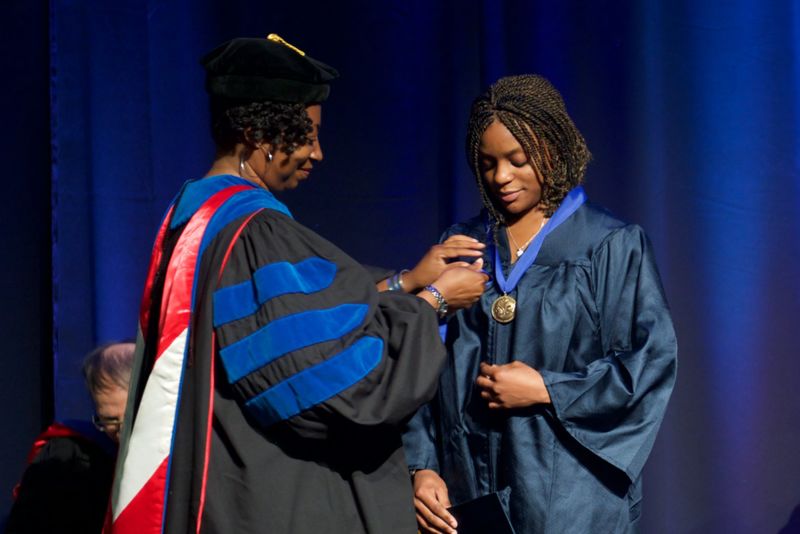 Photo of student graduating.