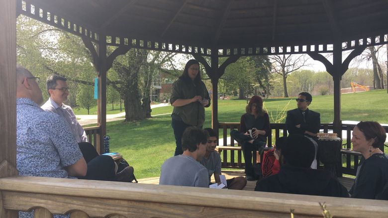 Joy speaking in the gazebo