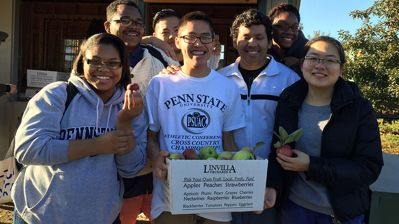 7 students with box of apples