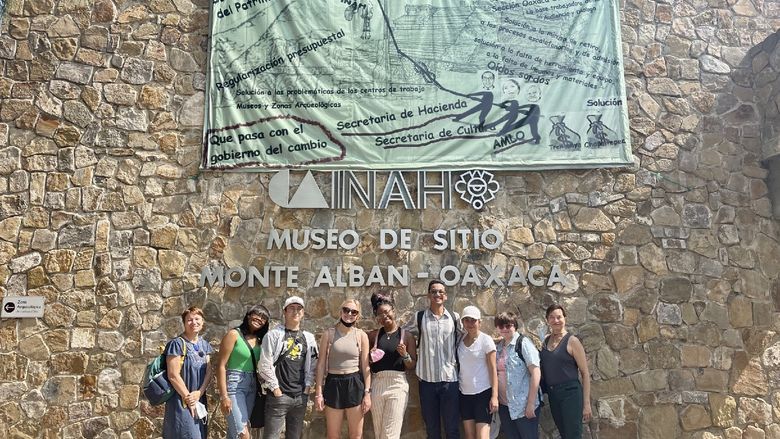Students and faculty advisors in front of a museum in Oaxaca