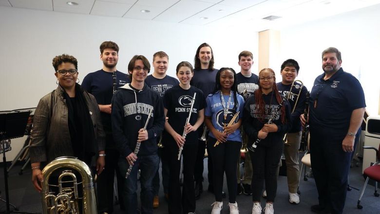 Group of people holding instruments