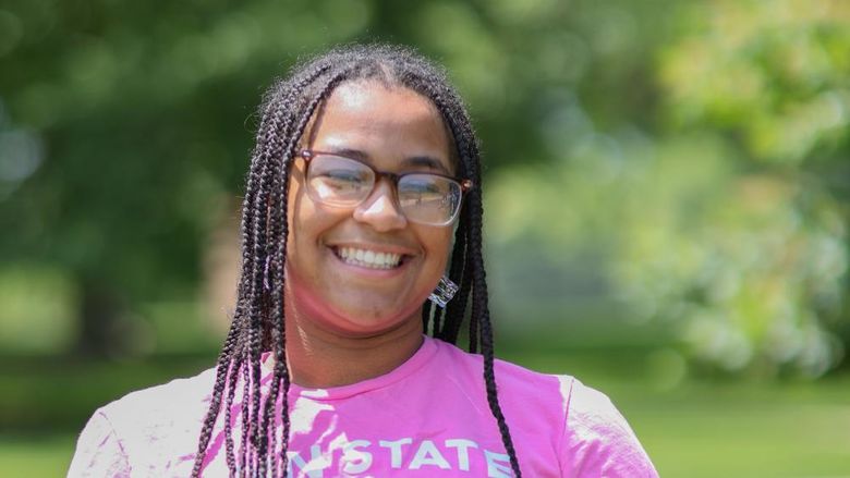 woman wearing glasses and Penn state shirt