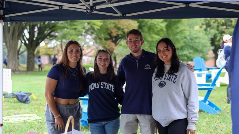 four students smiling