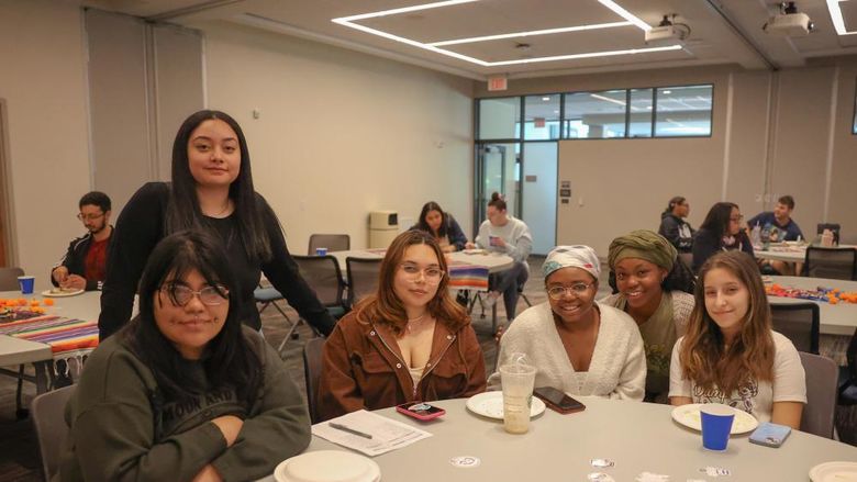 students gathered at a table