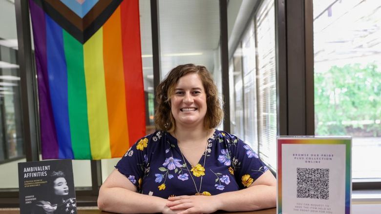Jane Homan with pride collection at Brandywine library