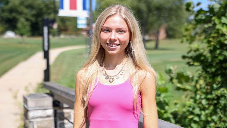 A female student standing on the Brandywine campus.