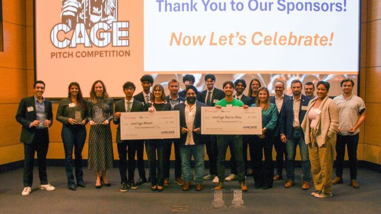 contestants holding large checks
