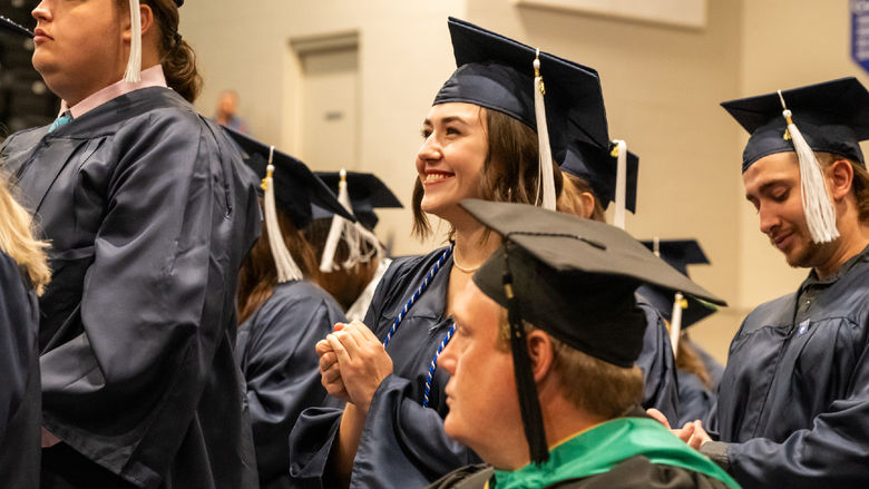 Penn State graduates celebrating commencement at the Fayette Campus.