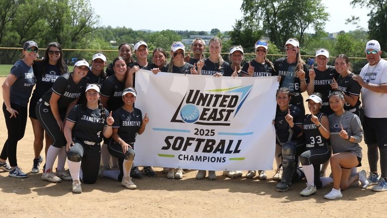 2025 softba/l team in photo holding United East Champion banner