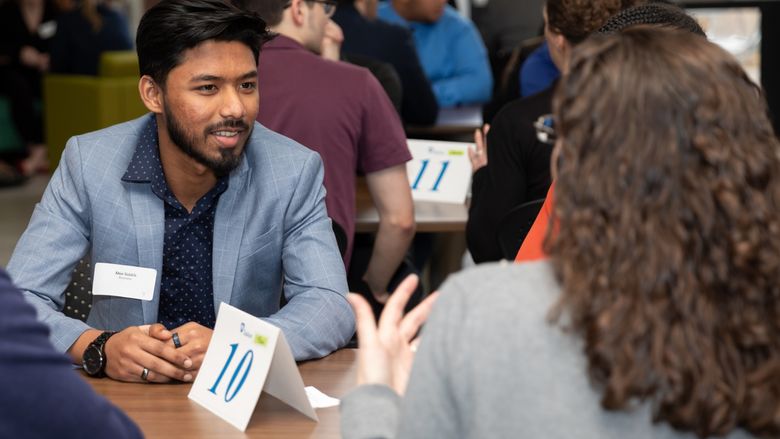 A Penn State Brandywine student speaking to a professional. 