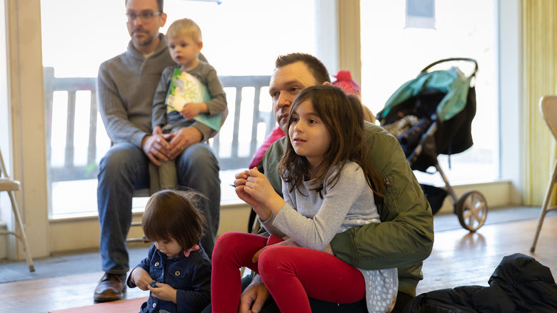 Families enjoy Penn State Brandywine students reading in a variety of languages.