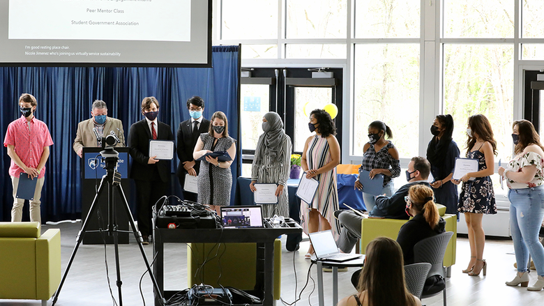 Students receiving their award certificates.
