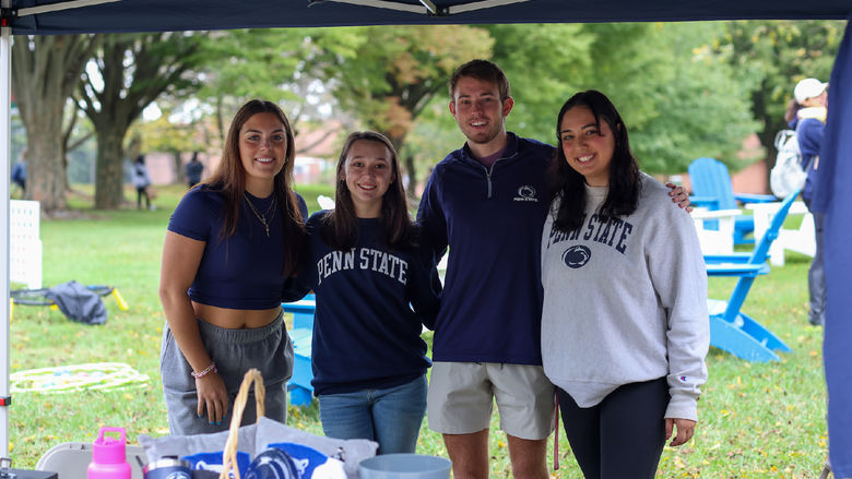 four students smiling