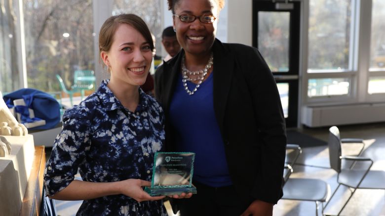 Haleigh Swansen and Ronika Money-Adams stand together with Haleigh's award