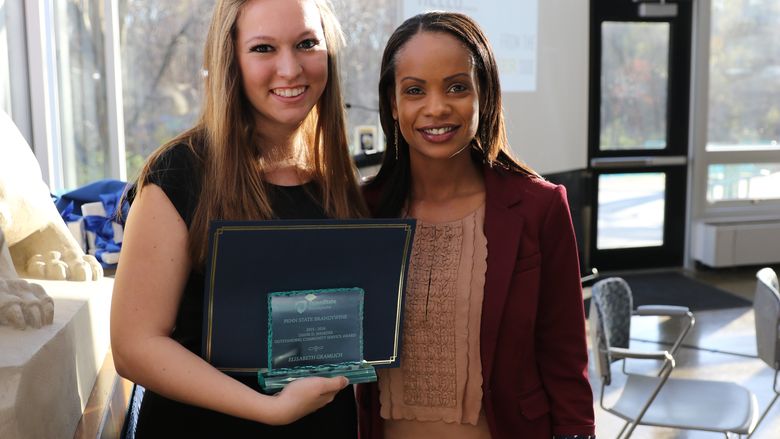 Elisabeth Gramlick and Stephanie Jones pose together with Elisabeth's award
