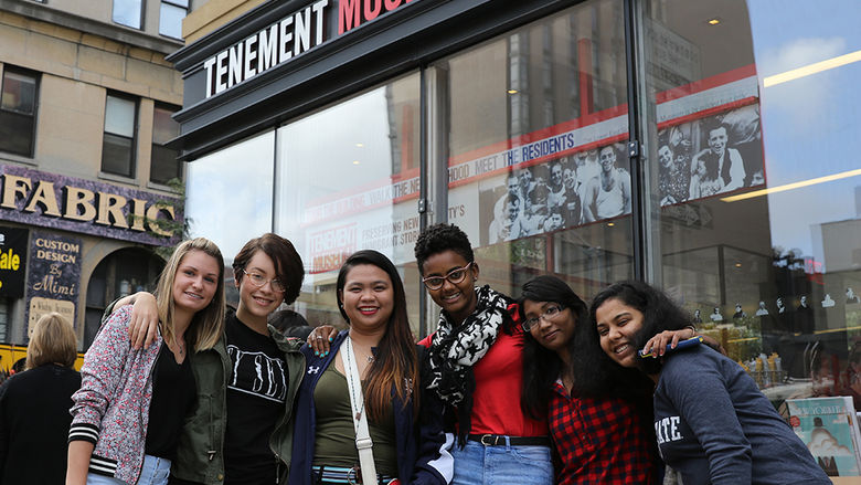students in front of Tenement Museum sign