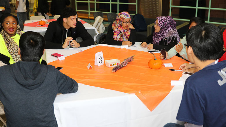 Students seated at Thanksgiving table