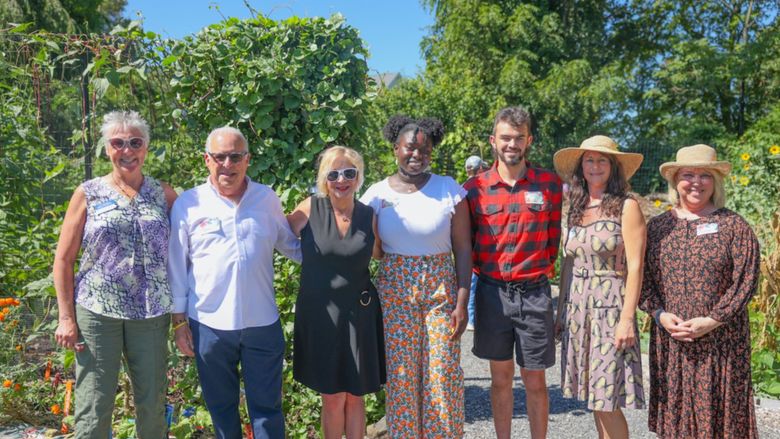 group of people smiling in garden
