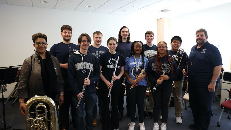 Group of people holding instruments