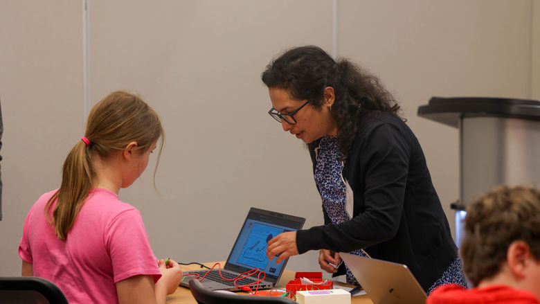 Shruti Shrestha helping student in workshop
