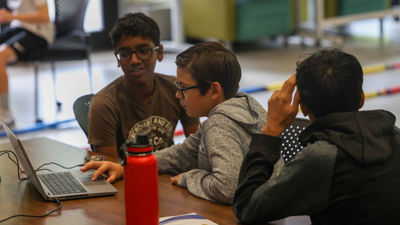 students working on computer