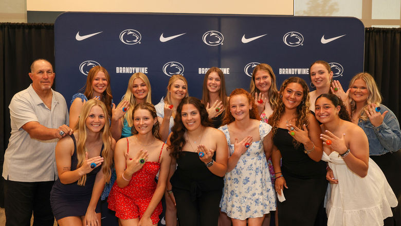 softball players holding up ring pops