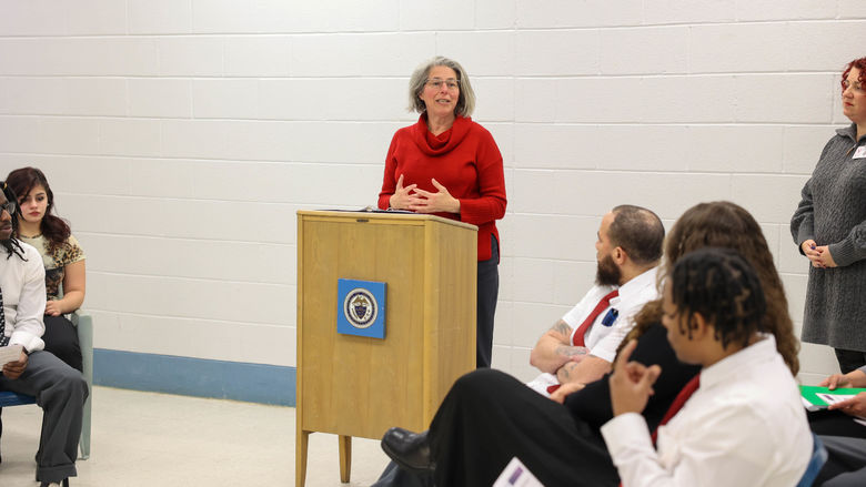 Jennifer Nesbitt speaking at podium
