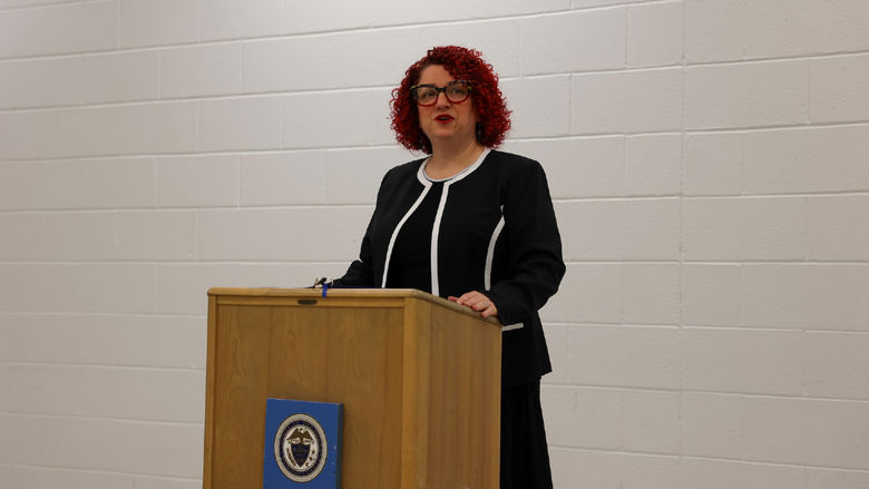 Angela Putman standing at podium