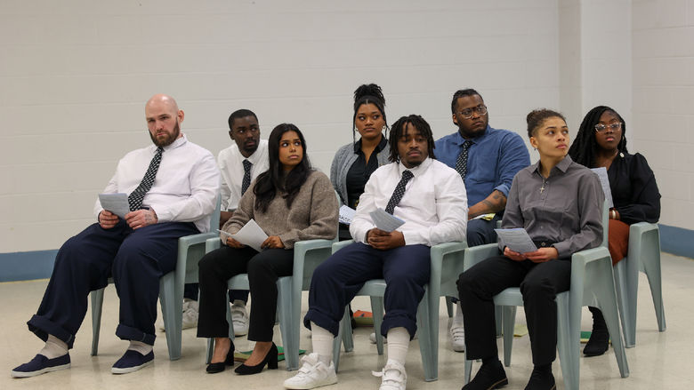 group of students sitting in chairs