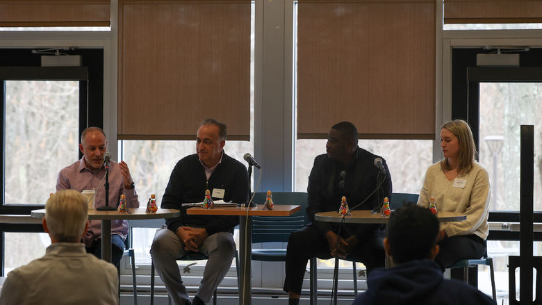 coaches speaking on a panel