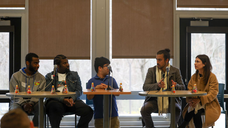 previous contestants speaking on a panel