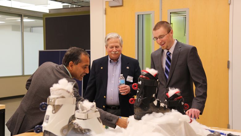 Guests discussing with SEG team member