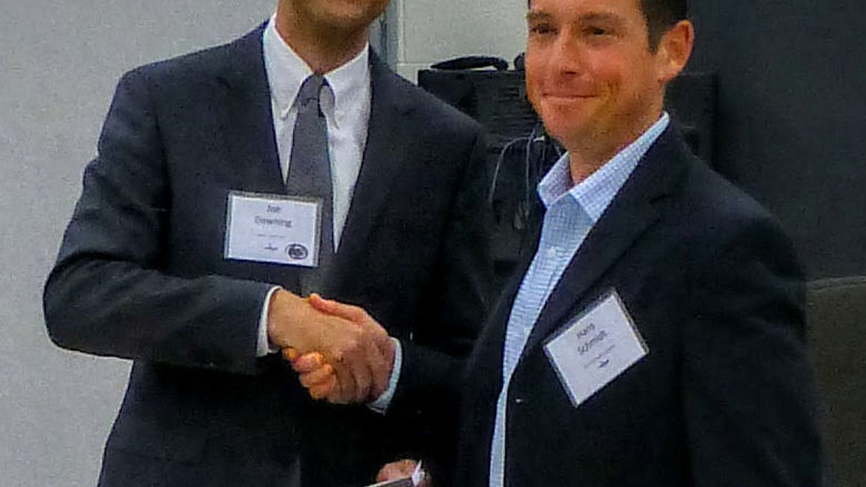 Hans Schmidt shakes hands with Joe Downing