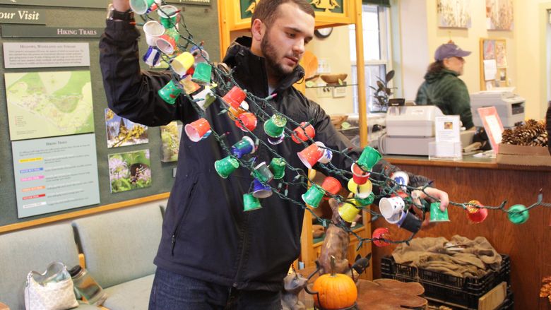 Students holding KCup String of Lights