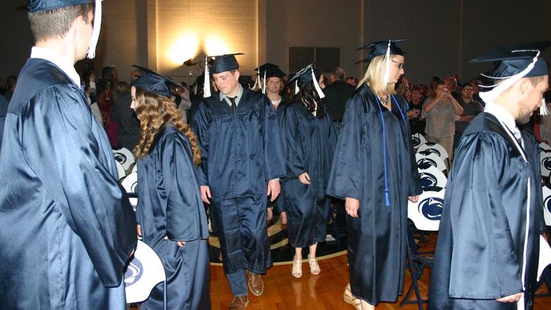Graduates process to their seats at the start of Commencement 2016.