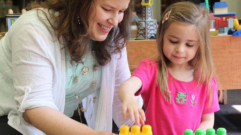 Jenn Zosh playing with child 