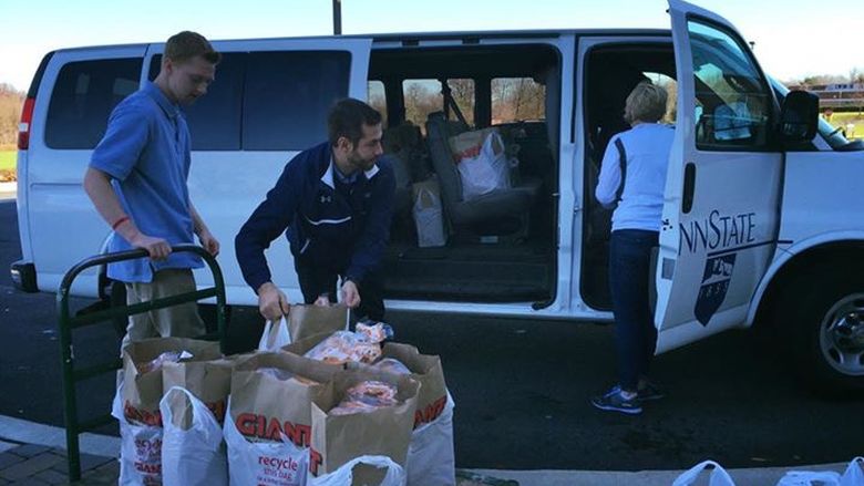 Students loading van with food