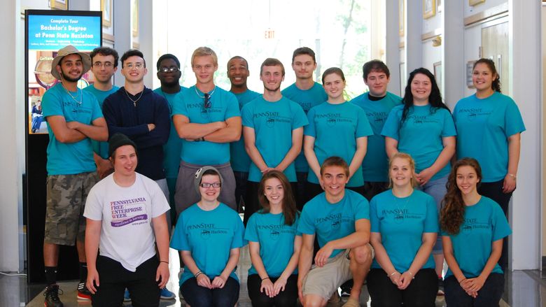 student group poses in PaSSS t-shirts