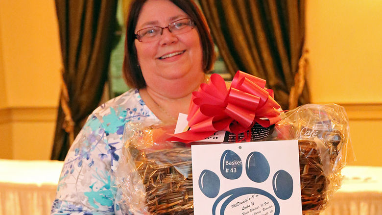 Theresa Walls holding gift basket