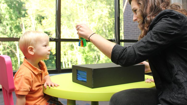 Student showing a child keys