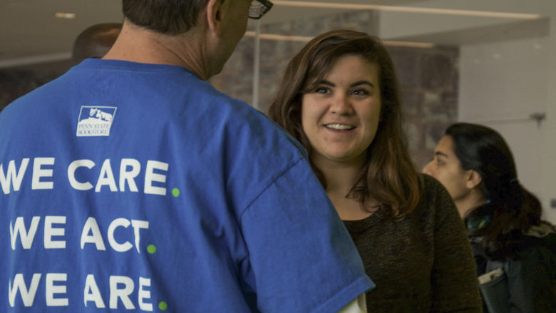 A staff member talking to a student 
