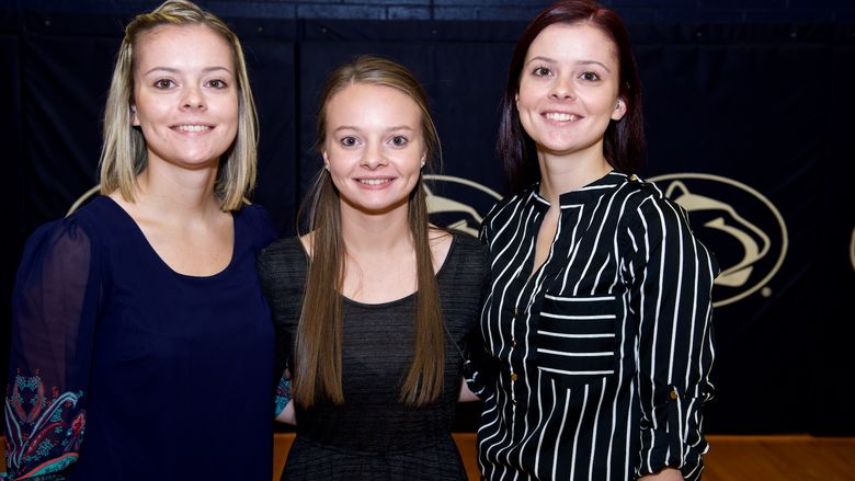 Three sisters pose for photo.
