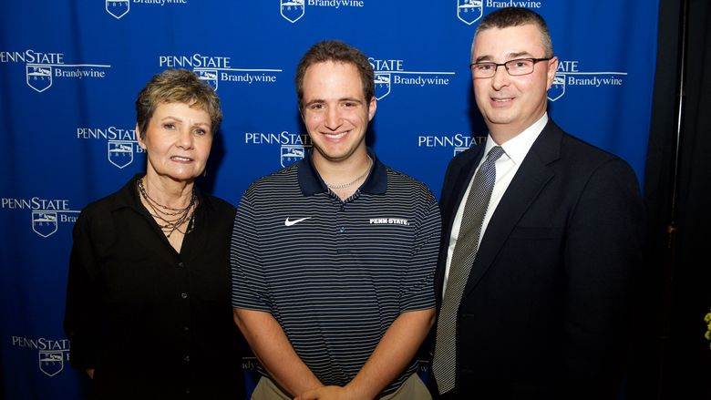 Paul Alberici stands with scholarship donors.