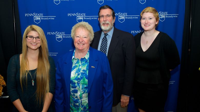Students stand with scholarship donors.
