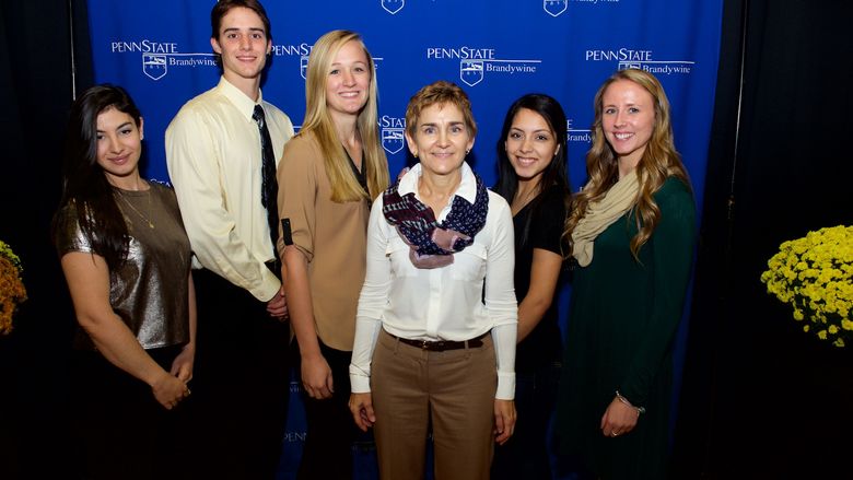 Linker Scholarship recipients and stand with donor