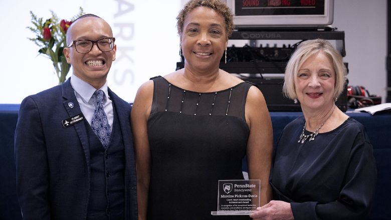 people holding an award