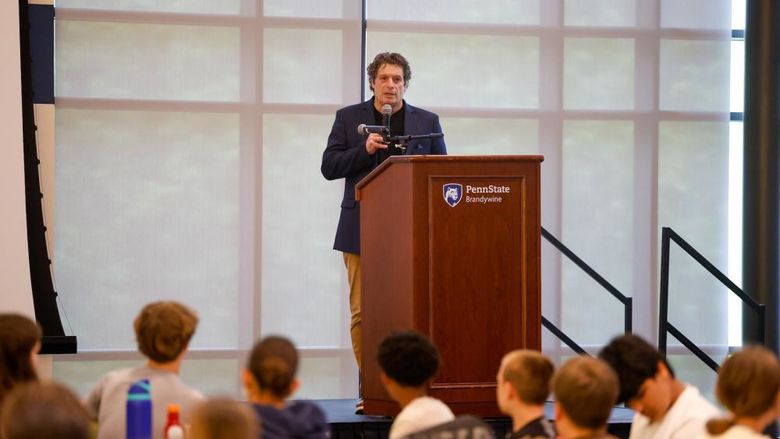 tony mattei speaking on stage